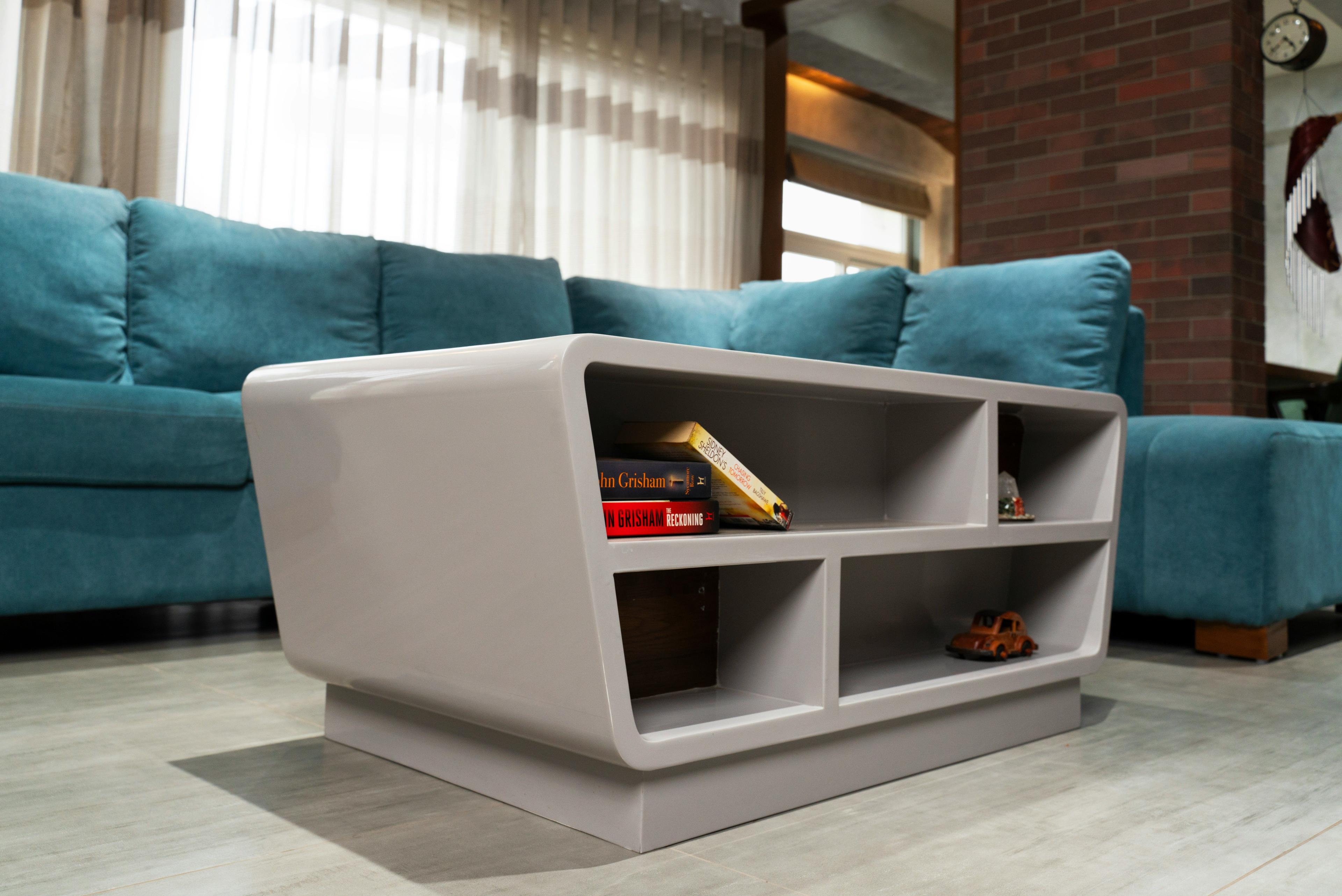 White storage bench with open compartments in a living space