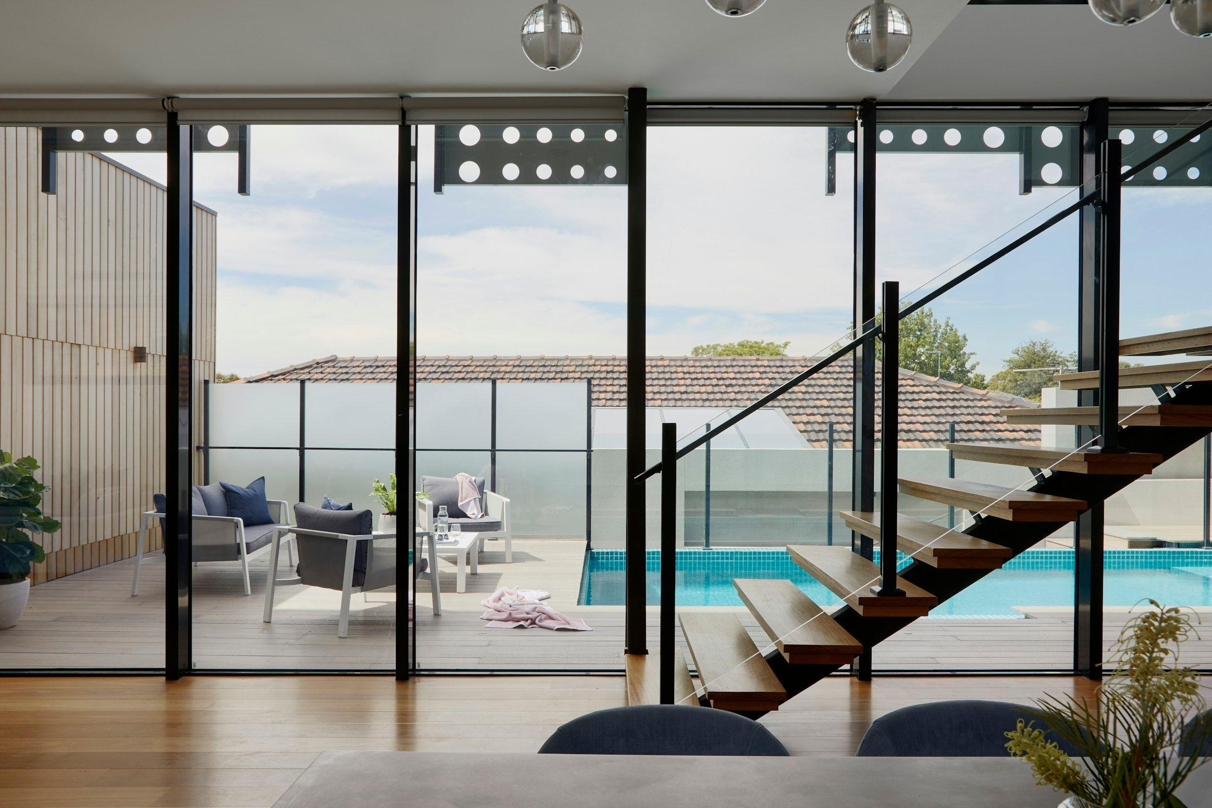 Glazed threshold between an interior room and an outdoor terrace