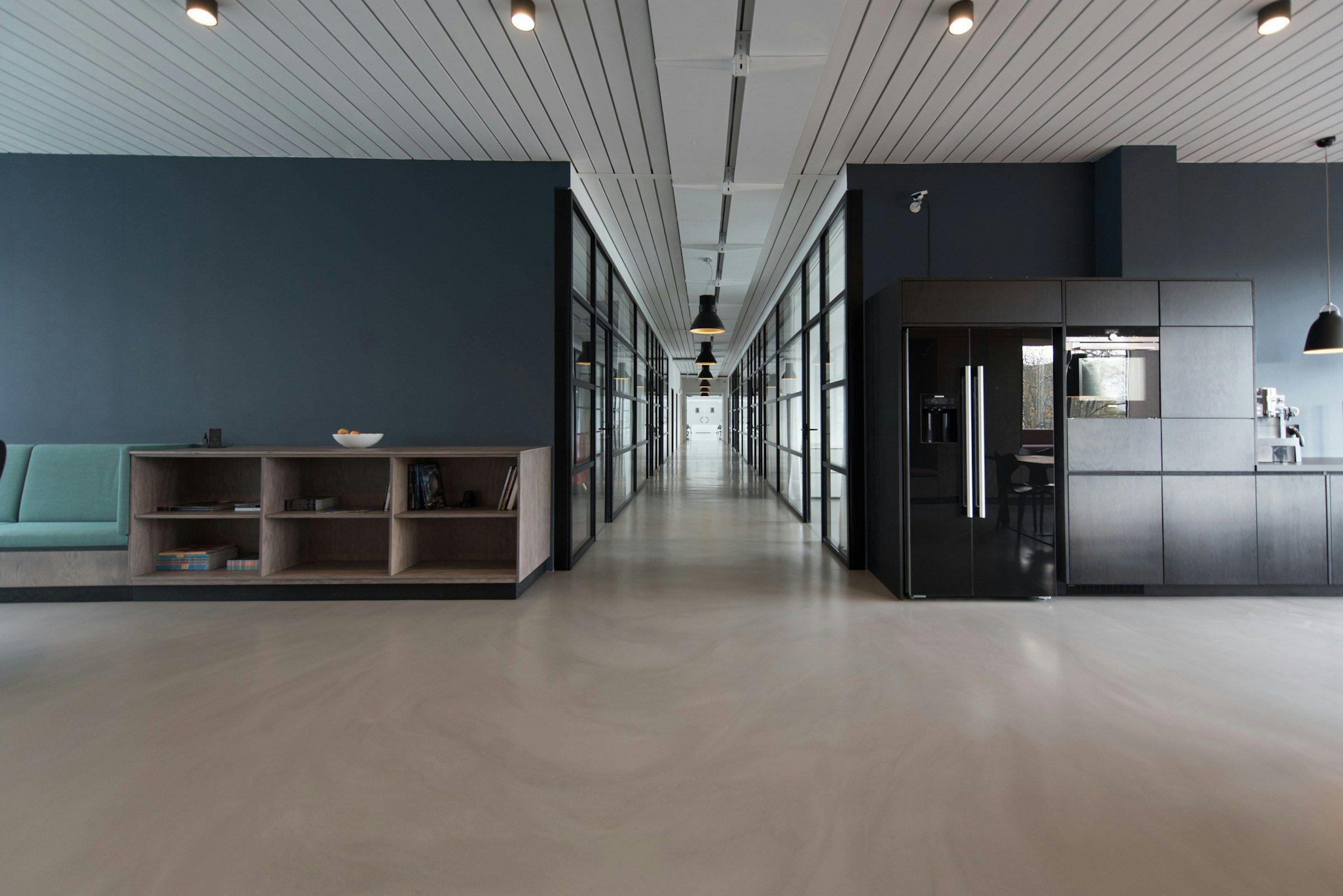 Interior corridor lined with low modular storage running the length of the wall